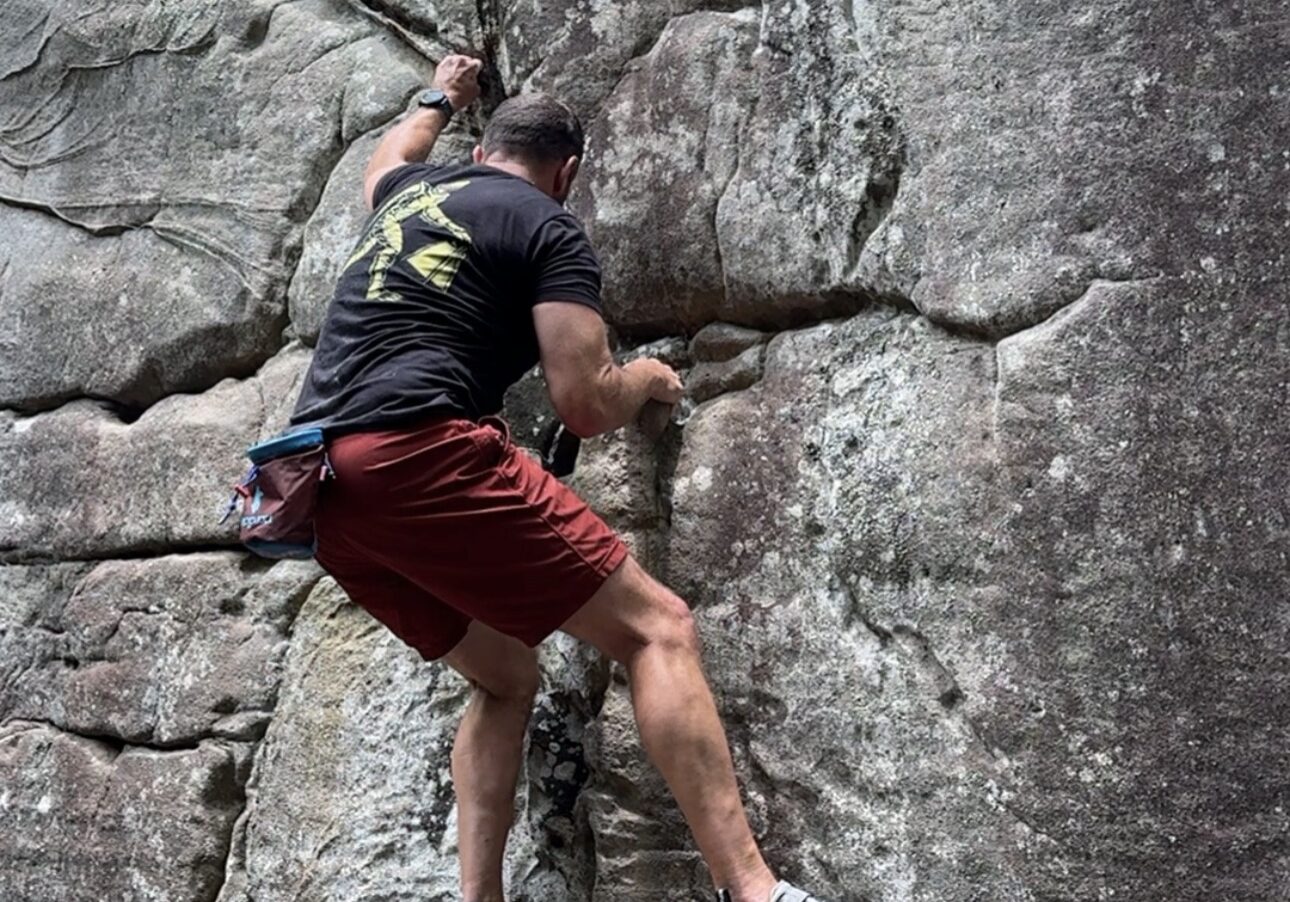 Man rock climbing during an outdoor group experience